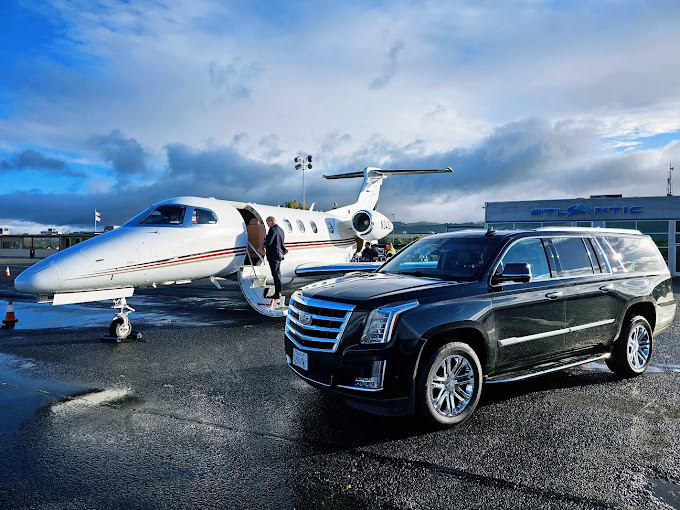 Escalade meeting a private jet on the tarmac